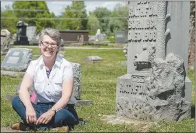  ?? (NWA Democrat-Gazette file photo/Anthony Reyes) ?? Abby Burnett, pictured at Bluff Cemetery in Springdale, is the author of “Gone to the Grave; Burial Customs of the Arkansas Ozarks 1850-1950,” published by The University Press of Mississipp­i in 2014, and speaks often about the rituals of death and dying.