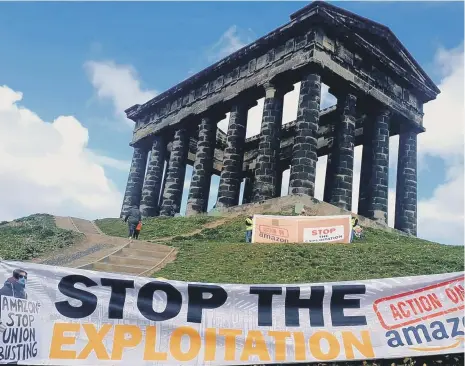  ??  ?? Campaigner­s in Sunderland gathered at Penshaw Monument for an anti-Amazon protest.