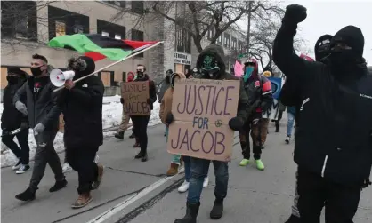  ?? Photograph: Mark Hertzberg/ZUMA Wire/REX/Shuttersto­ck ?? Jacob Blake’s uncle, Justin Blake, leads march on 11 January, at the Kenosha, Wisconsin, municipal building, calling for the firing of police officer Rusten Sheskey.