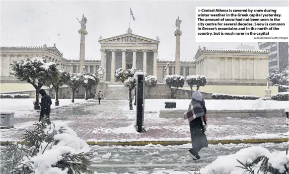  ?? Milos Bicanski/Getty Images ?? Central Athens is covered by snow during winter weather in the Greek capital yesterday. The amount of snow had not been seen in the city centre for several decades. Snow is common in Greece’s mountains and in the north of the country, but is much rarer in the capital