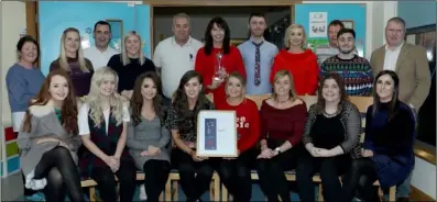  ??  ?? All the staff of our Rehabcare team with the Pride of Place award and photo frame.