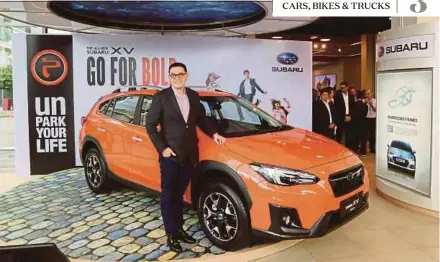  ??  ?? Tan Chong Internatio­nal Ltd managing director Glenn Tan with the all-new Subaru XV.