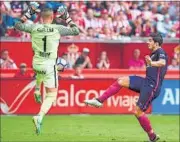  ??  ?? Luis Suarez (right) rounded Sporting goalkeeper Ivan Cuellar to tap in Barcelona’s opener in the 29th minute. REUTERS PHOTO