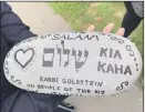  ??  ?? Rabbi Goldstein laid a stone in memory of the victims