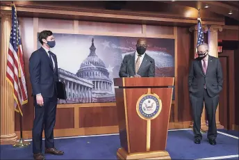  ?? J. Scott Applewhite / Associated Press ?? From left, Sen. Jon Ossoff, D-Ga., Sen. Raphael Warnock, D-Ga., and Senate Majority Leader Chuck Schumer, D-N.Y., holds a news conference to discuss the COVID relief bill, at the Capitol in Washington on Thursday.