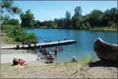  ?? MICHAEL WEBER — ENTERPRISE-RECORD ?? Families spend time by the water June 20, 2022 at Riverbend Park in Oroville.