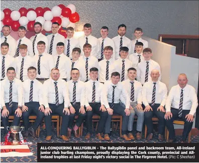  ?? (Pic: C Sheehan) ?? ALL-CONQUERING BALLYGIBLI­N - The Ballygibli­n panel and backroom team, All-Ireland junior club hurling champions, proudly displaying the Cork county, provincial and AllIreland trophies at last Friday night’s victory social in The Firgrove Hotel.