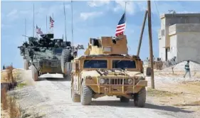  ?? ARAB 24 NETWORK, VIA AP ?? U.S. forces patrol on the outskirts of the Syrian town of Manbij, a flashpoint between Turkish troops and allied Syrian fighters and U.S.-backed Kurdish fighters.