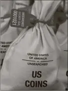  ??  ?? UNSEARCHED: Pictured above are the unsearched Vault Bags loaded with nearly 3 pounds of U.S. Gov’t issued coins some dating back to the 1800’s being handed over to Texas residents by Federated Mint.