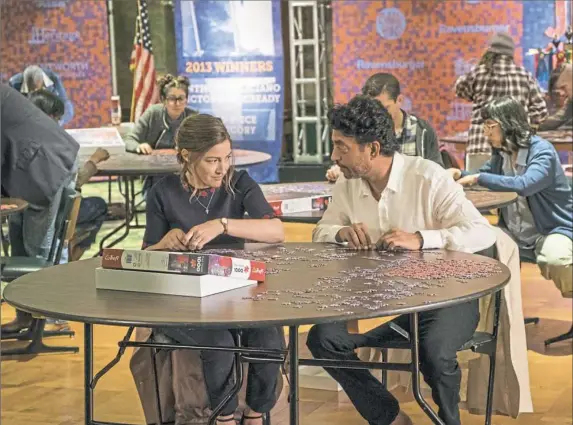  ?? Linda Kallerus/Sony Pictures Classics ?? Kelly Macdonald as Agnes and Irrfan Khan as Robert bond over a shared passion in “Puzzle.”