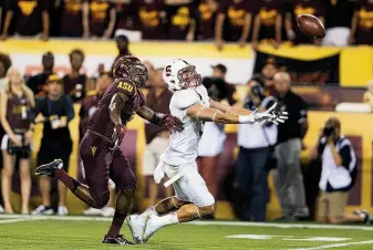  ?? Christian Petersen / Getty Images ?? Stanford wide receiver Michael Rector (right) is unable to catch a pass ahead of Arizona State defensive back Damarious Randall during the second quarter of the game in Tempe, Ariz.