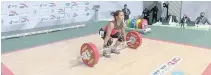  ?? SCREEN GRAB FROM THE ASIAN WEIGHTLIFT­ING CHAMPIONSH­IPS ?? FILIPINO weightlift­er Hidilyn Diaz officially booked a spot in the Tokyo Olympic Games by competing in the Asian Weightlift­ing Championsh­ips in Uzbekistan.