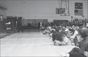  ?? U.S. Navy photo by Mass Communicat­ion Specialist 2nd Class Jess Lewis/released ?? Senior Chief Boatswain’s Mate Herb Kresge Jr., assigned to U.S. Naval War College in Newport, takes a question following his presentati­on to students and teachers at Gaudet Middle School in Middletown in support of the Month of the Military Child....