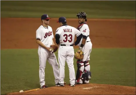  ?? PHOTO COURTESY OF RUBEN NIEBLA ?? Imperial Valley native Ruben Niebla (center) talks to Cleveland Indians pitcher Cory Kluber (left) and Carlos Santana.