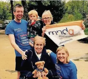  ??  ?? ●● Clint Spencer successful­ly completed five half marathons and a 12-mile extreme obstacle race in just four weeks. He is pictured with his wife and her aunt, Lesley Silvester, and other members of the family