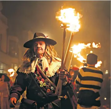  ??  ?? Homage to parliament­ary rule: a Bonfire Night parade in Lewes, East Sussex, celebrates the defeat of Guy Fawkes’ plot in 1605