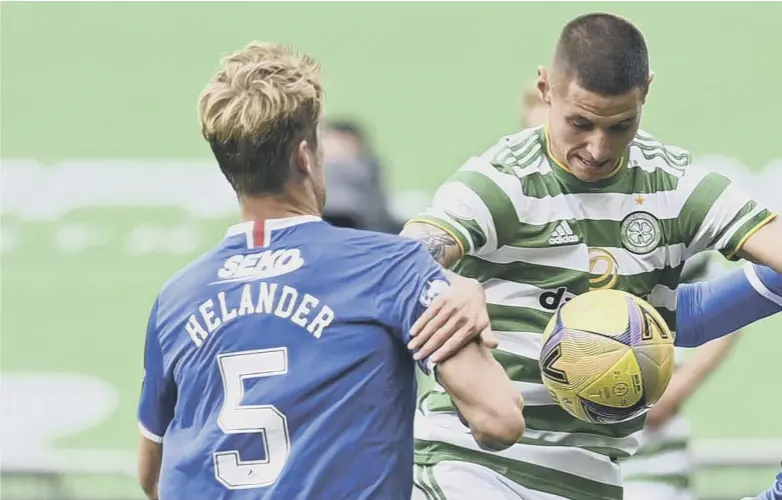  ??  ?? 0 Celtic’s Patryk Klimala holds off Rangers’ Filip Helander and Glen Kamara on Saturday