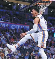  ?? SUE OGROCKI / AP ?? Russell Westbrook celebrates after a dunk against the Memphis Grizzlies in Oklahoma City on Wednesday.