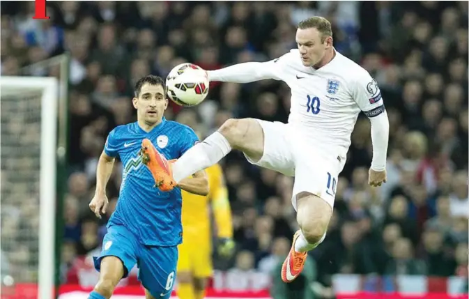  ?? — AP ?? LONDON: This is a Saturday, Nov. 15, 2014 file photo of England’s Wayne Rooney, right, as he controls the ball in front of Slovenia’s Branko Ilic, during their Euro 2016 Group E qualifying soccer match at Wembley Stadium, London. England striker Wayne...