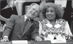  ??  ?? LEFT: Former President Bush laughs with Doris Hicks, CEO/Principal of Dr. Martin Luther King Jr. Charter School of Science and Technology, during a roundtable discussion on education at Warren Easton Charter High School.