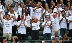  ?? ?? Fans of Henry Searle wearing T-shirts saying ‘Henry’s Barmy Army’ celebrate his victory in the Wimbledon boys’ singles final against Yaroslav Demin. Photograph: Shaun Botterill/ Getty Images