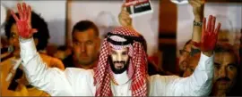  ?? Reuters ?? A demonstrat­or protesting the killing of journalist Jamal Kashoggi wears a mask of Saudi Crown Prince Mohammed bin Salman and holds up ‘blood’-stained hands.