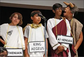  ?? Katharine Lotze/The Signal ?? (Above) A student dressed as Icarus waits for his part in a play about Theseus and the Minotaur as part of the curriculum about ancient Greece at Pinetree Community School on Wednesday. (Below) Sixth grade students at Pinetree Elementary in Canyon...