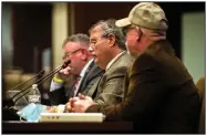  ??  ?? State Rep. Marcus Richmond (from left), anthropolo­gist Tim Jones and Principal Chief Chuck Hoskin Jr. of the Cherokee Nation address the House Committee on State Agencies and Government­al Affairs on Monday.