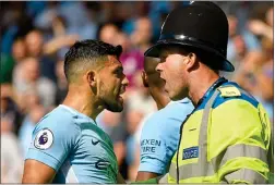  ??  ?? HEATED: Aguero tries to make his case to police after a fan is hauled down