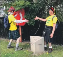  ??  ?? David Logue, left, and Chris Tabraham congratula­te each other – suitably distanced, of course – on completing the nine-mile stroll from Ardrishaig to Crinan.