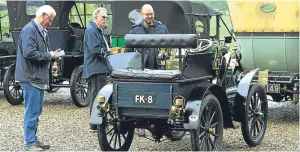  ??  ?? Top: a 1905 White Steam Car and, above, enthusiast­s admire the vehicles.