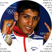  ?? Photo: ACTION IMAGES/RICHARD HEATHCOTE ?? WHERE IT ALL BEGAN: Khan clutches the 2004 Olympic silver medal that made him a star