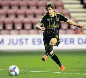  ??  ?? Sam Nicholson squanders a good chance for Bristol Rovers against Wigan with a shot which was blocked on the goalline