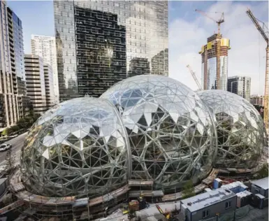  ?? CHRISTOPHE­R MILLER/THE NEW YORK TIMES ?? The biospheres at Amazon’s headquarte­rs in downtown Seattle in October. Amazon’s hunt for a second headquarte­rs city has been narrowed down from 238 bids to 20 finalists, including Toronto.