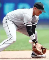  ?? GETTY IMAGES ?? Ryan Goins, bobbling a grounder in the sixth inning Thursday, recently was called up from Charlotte, where he played with the red-hot Luis Robert.