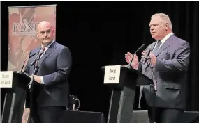  ?? GINO DONATO THE CANADIAN PRESS FILE PHOTO ?? Liberal Leader Steven Del Duca, left, watches as Progressiv­e Conservati­ve Leader Doug Ford speaks at the Federation of Northern Ontario Municipali­ties debate on May 10.