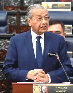  ??  ?? Dr Mahathir presenting the mid-term review of the 11th Malaysia Plan 2016-2020. — Bernama photo