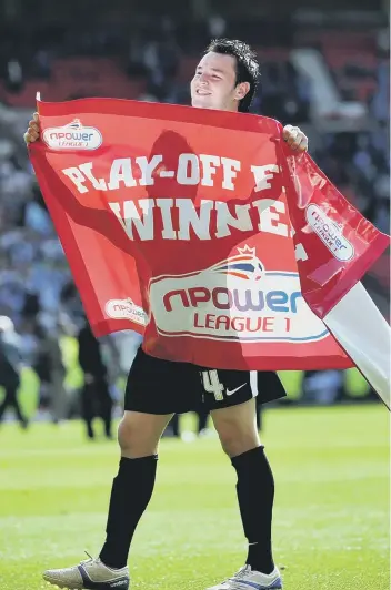  ??  ?? Lee Tomlin celebrates Posh’s League One play-off win at Old Trafford in 2011.