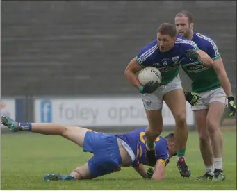  ??  ?? John Leacy in full command of the situation for Glynn-Barntown, with back-up from Brendan Doyle.