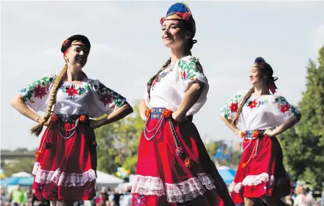  ?? KAYLE NEIS ?? Traditiona­l Ukrainian dancer Kaitlin Kliewer, centre, performs during the Ukrainian Day in the Park at Rotary Park on Saturday. The event celebrated Ukrainian culture and its influence on Saskatoon and Saskatchew­an.