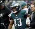  ?? THE ASSOCIATED PRESS FILE ?? The Eagles’ Darren Sproles, center in this file photo with concerned coach Doug Pederson to the left, has yet to play this season due to a hamstring injury. That streak will continue Sunday as Sproles will miss the Birds’ game against the Jaguars in London.