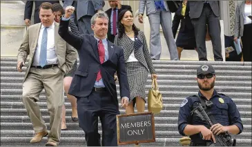  ?? SUSAN WALSH / ASSOCIATED PRESS ?? U.S. Rep. Matt Cartwright, D-Pa., salutes protesters nearby as he and other members of the House of Representa­tives leave the Capitol following the American Health Care Act vote.