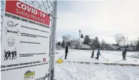  ?? CLIFFORD SKARSTEDT EXAMINER ?? A COVID-19 safety warning sign alerts skaters trying out the ice at the Havelock Community outdoor rink recently.