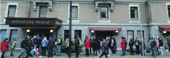  ?? ADRIAN LAM, TIMES COLONIST ?? People line up outside Miniature World during the Be A Tourist in Your Own Hometown promotion in March 2014.