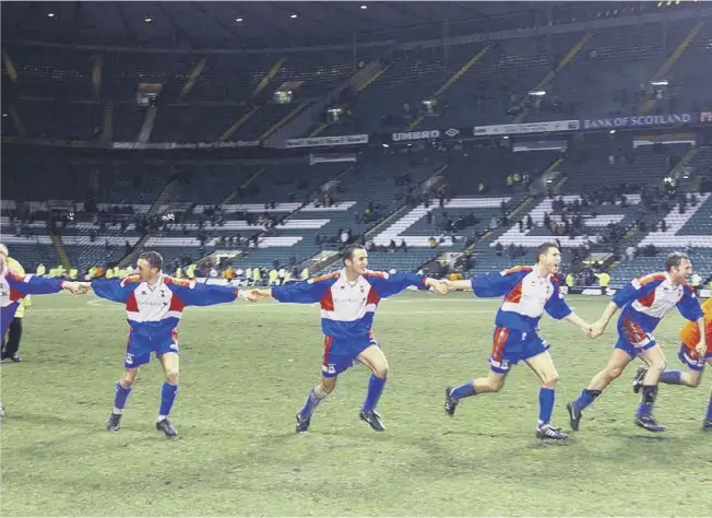  ??  ?? 0 Inverness Caley Thistle players run towards their fans in joy after the final whistle sounded on their shock 3-1 Scottish Cup victory over Celtic at Parkhead 20 years ago. kick with a header which found its way into the Celtic net for the visitors’ decisive second goal. Right. the defender is congratula­ted by his team-mates before completing