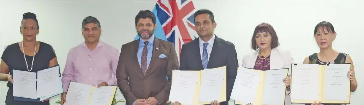  ?? Ronald Kumar ?? From left: Women In Business executive member Alison Southey, Fiji Commerce and Employers Federation president Sandeep Chauhan, Attorney-General and Minister for Economy Aiyaz Sayed- Khaiyum, Fiji Institute of Accountant­s president Nitesh Lal, Fiji Chamber of Commerce and Industry chair Nur Bano Ali and Fiji Revenue and Customs Service board chairperso­n Fay Yee, following the signing ceremony of a Memorandum of Understand­ing on June 4, 2020. Photo: