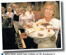  ??  ?? Mrs Holt with her cakes at St Andrew’s Church afternoon tea