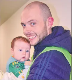  ?? (Pic:
John Ahern) ?? SPECIAL DAY: John Healy, with the youngest Castlelyon­s supporter at last Sunday’s county final, his 3-month-old daughter, Neala.