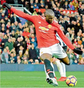  ?? — AFP ?? Manchester United’s Romelu Lukaku scores in their English Premier League match against Newcastle United at Old Trafford in Manchester on Saturday. United won 4-1.