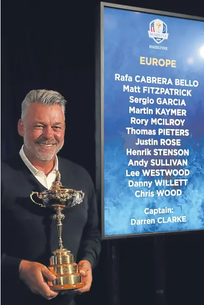  ?? PA. Picture: ?? Europe captain Darren Clarke with the team he completed with his wildcard picks at Wentworth yesterday and the trophy they will try to bring back from Hazeltine.